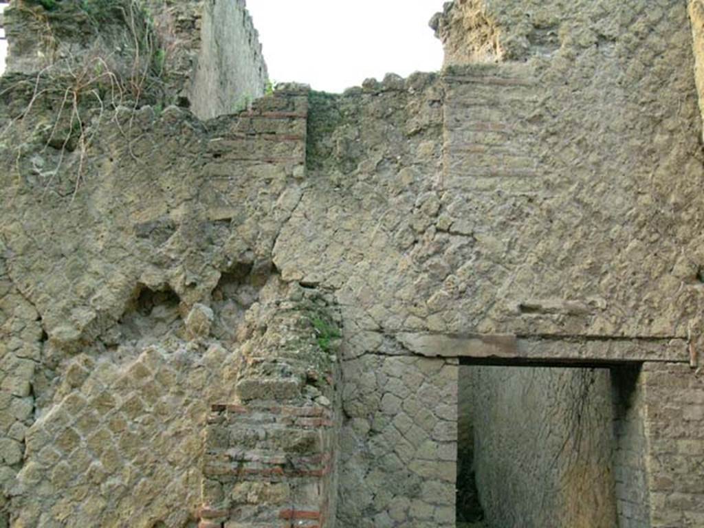 Ins Or II, 7, Herculaneum. December 2004.
Looking west through doorway in west wall of a room, reached by Ins.Or.II.7, but which may be part of the rooms of the Palaestra at Ins.Or.II.4 (room C).
Photo courtesy of Nicolas Monteix.
